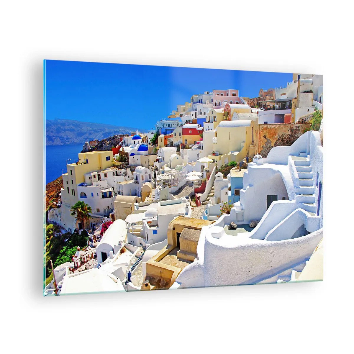 Obraz na skle - Santorini s bielymi domami na pozadí modrej oblohy - 70x50cm - Sen o gréckom lete - Moderná nástenná dekorácia do obývacej izby a spálne ARTTOR