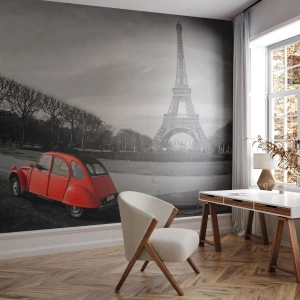 Fototapeta Standard Eco - Červené auto pred vežou v čiernobielom Paríži - 100x70cm - Viac parížske ako samotný Paríž - Moderná nástenná dekorácia do obývacej izby a spálne ARTTOR