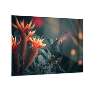 Obraz na skle - Kolibrík sa vznáša nad exotickými kvetmi medzi listami. - 70x50cm - Skutočne pestrý život - Moderná nástenná dekorácia do obývacej izby a spálne ARTTOR