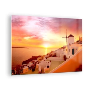 Obraz na skle - Západ slnka nad Santorini s bielymi budovami a veterným mlynom - 70x50cm - Rozplynúť sa v bielej a zlatej - Moderná nástenná dekorácia do obývacej izby a spálne ARTTOR