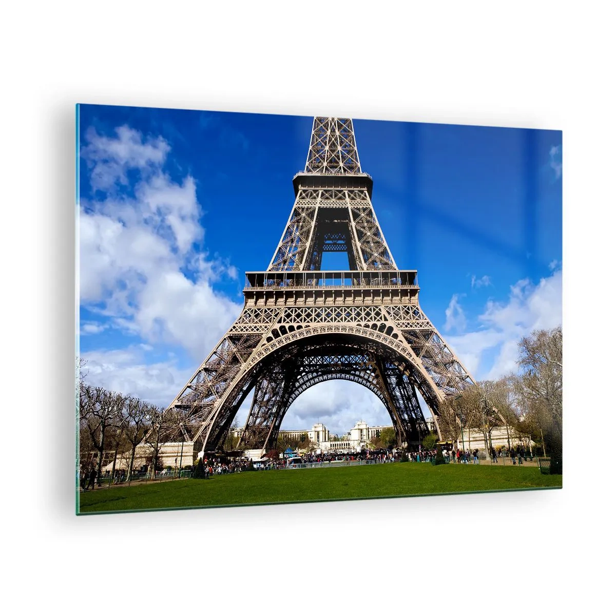 Obraz na skle - Eiffelova veža proti modrej oblohe - 70x50cm - Celý Paríž pri jej nohách - Moderná nástenná dekorácia do obývacej izby a spálne ARTTOR