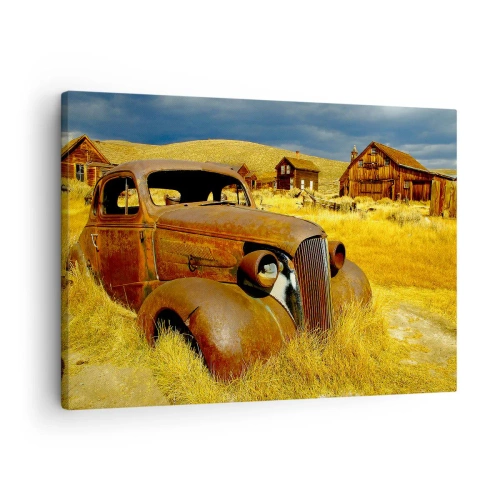 Obraz na plátne - Staré hrdzavé auto na pozadí opustených drevených chatrčí - 70x50cm - Zaslúžený odpočinok - Moderná nástenná dekorácia do obývacej izby a spálne ARTTOR