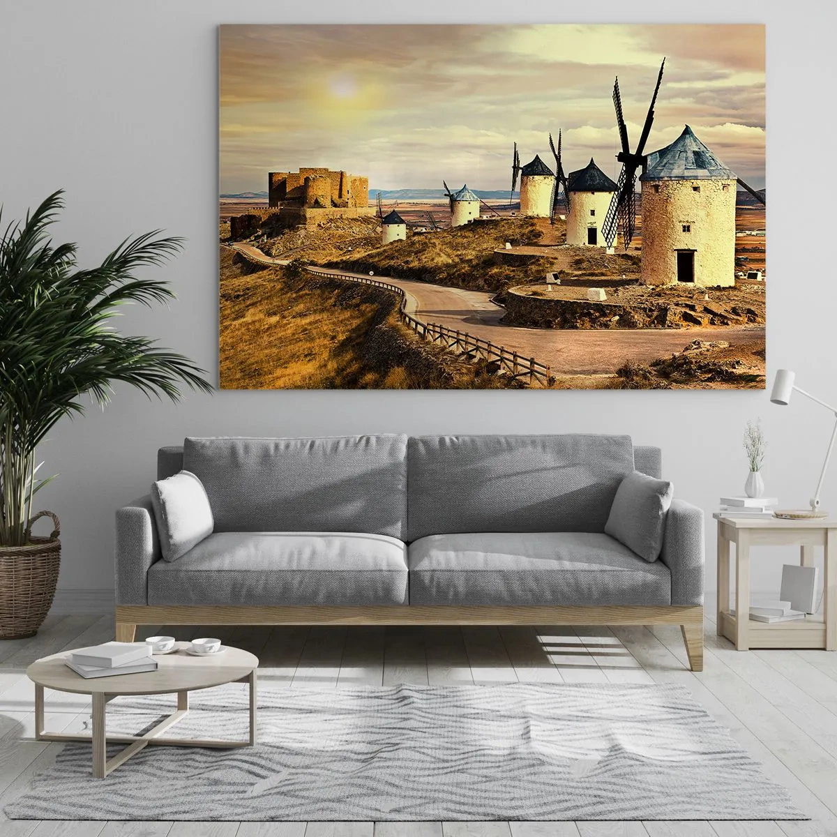 Obraz na skle - Veterné mlyny a hrad v krajine pri západe slnka - 70x50cm - Čoskoro sa objaví Don Quijote - Moderná nástenná dekorácia do obývacej izby a spálne ARTTOR