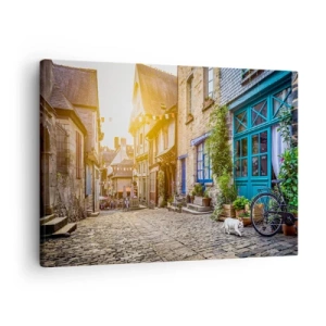 Obraz na plátne - Očarujúca ulica s kamennou dlažbou zaliatou slnečným svetlom - 70x50cm - Biely duch mestečka - Moderná nástenná dekorácia do obývacej izby a spálne ARTTOR