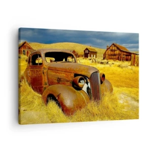 Obraz na plátne - Staré hrdzavé auto na pozadí opustených drevených chatrčí - 70x50cm - Zaslúžený odpočinok - Moderná nástenná dekorácia do obývacej izby a spálne ARTTOR
