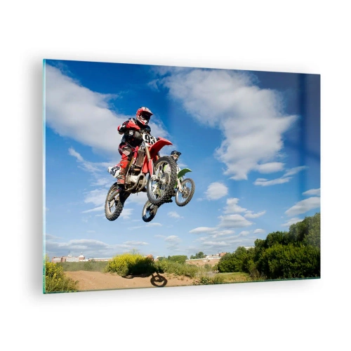 Obraz na skle - Motocyklový pretekár za letu proti modrej oblohe - 70x50cm - Skok z oblakov - Moderná nástenná dekorácia do obývacej izby a spálne ARTTOR