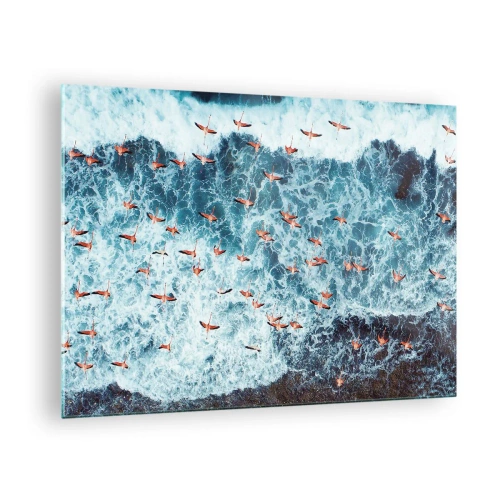 Obraz na skle - Ružové plameniaky nad rozbúrenými vlnami oceánu - 70x50cm - Prímorský sprievod - Moderná nástenná dekorácia do obývacej izby a spálne ARTTOR