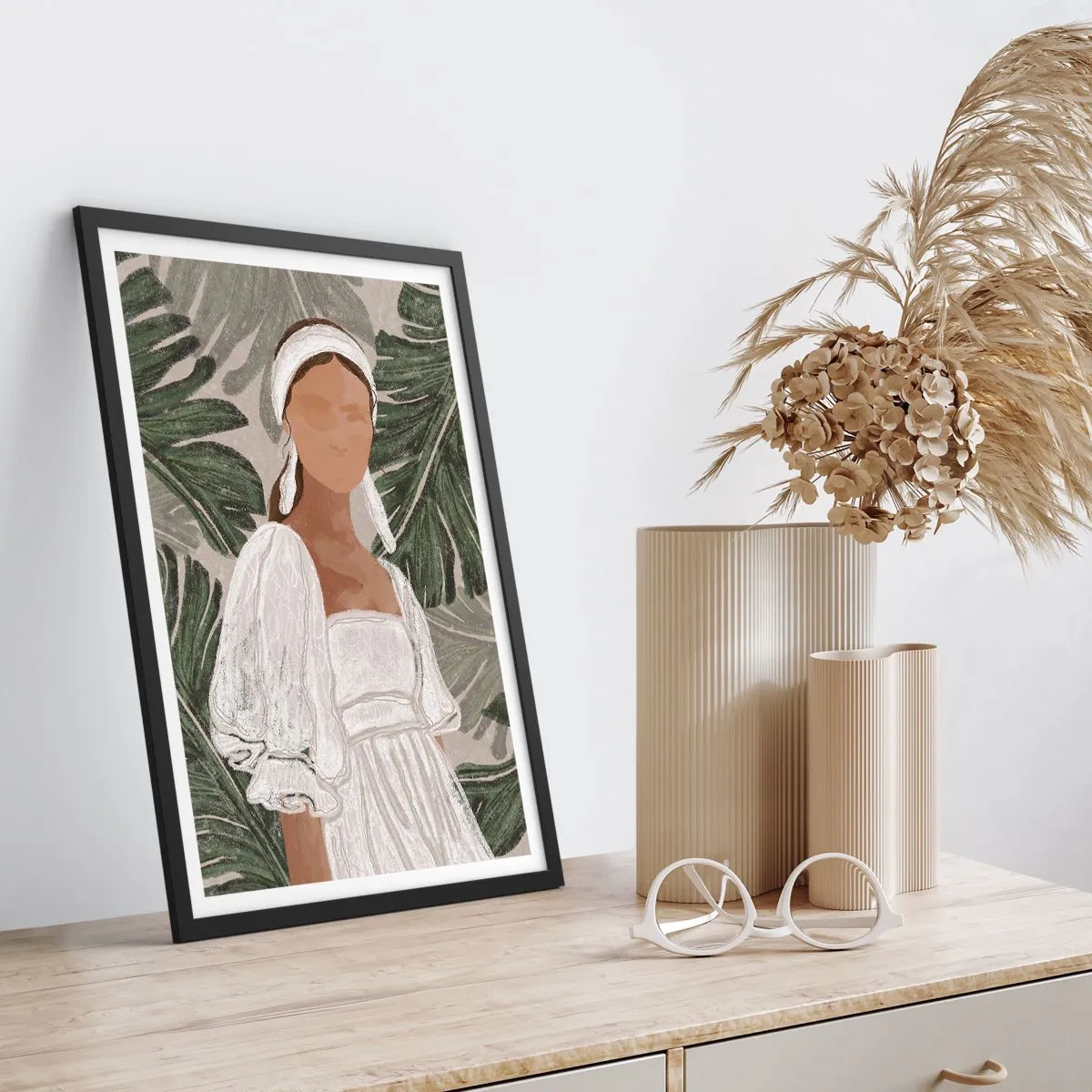 Plagát v čiernom ráme - Žena v bielych šatách na pozadí zelených listov - 50x70cm - Exotický portrét - Moderná nástenná dekorácia do obývacej izby a spálne ARTTOR