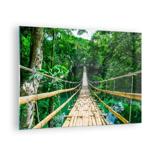 Obraz na skle - Visutý bambusový most uprostred tropickej zelene ponad rieku - 70x50cm - Opičí most nad zeleňou - Moderná nástenná dekorácia do obývacej izby a spálne ARTTOR