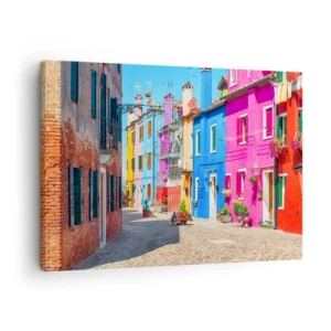 Obraz na plátne - Farebné budovy v úzkej mestskej ulici - 70x50cm - Mestečko „Pod papagájmi“ - Moderná nástenná dekorácia do obývacej izby a spálne ARTTOR