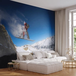 Fototapeta Standard Eco - Snowboardista skáče na pozadí zasnežených hôr. - 100x70cm - A stal si sa súčasťou priestoru - Moderná nástenná dekorácia do obývacej izby a spálne ARTTOR