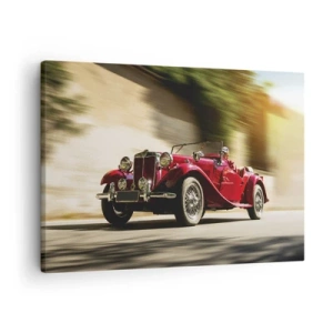 Obraz na plátne - Červené klasické auto v pohybe na slnečnej ulici - 70x50cm - Krajšia ako Níke Samotrácka - Moderná nástenná dekorácia do obývacej izby a spálne ARTTOR