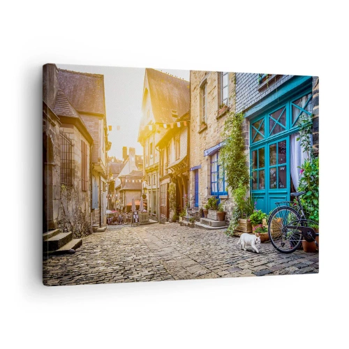 Obraz na plátne - Očarujúca ulica s kamennou dlažbou zaliatou slnečným svetlom - 70x50cm - Biely duch mestečka - Moderná nástenná dekorácia do obývacej izby a spálne ARTTOR