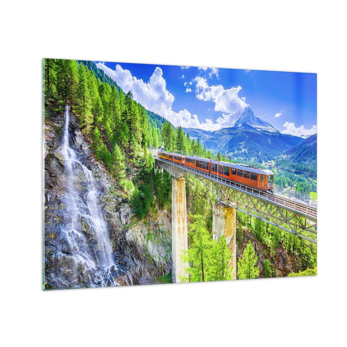 Obraz na skle - Alpský vláčik na moste s výhľadom na vodopád - 70x50cm - Alpská železnica - Moderná nástenná dekorácia do obývacej izby a spálne ARTTOR